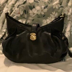 Authentic Louis Vuitton Mahina XS Monogram Black Leather Shoulder Bag.